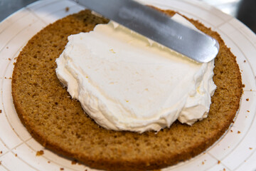 view of making cake with bread and cream