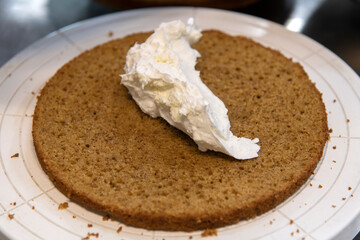 view of making cake with bread and cream