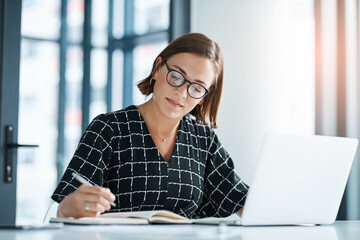 Office, woman and laptop or writing in journal for proposal, application and requirement to...
