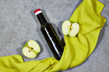 Apple cider or juice drink and green apple. Garden organic green apple and fermented drink