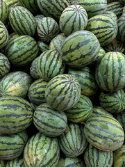 Lots of fresh organic watermelons at the farmer's market, top view. 