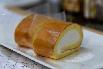 sliced cream cake on the plate