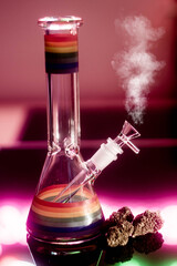 Glass bong cannabis and smoke on red neon background, space for text. Smoking device