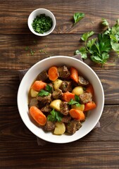 Beef meat stewed with potatoes, carrots and spices