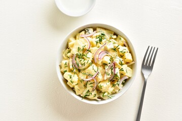 Potato salad with egg, pickle, red onion with mayonnaise and yog