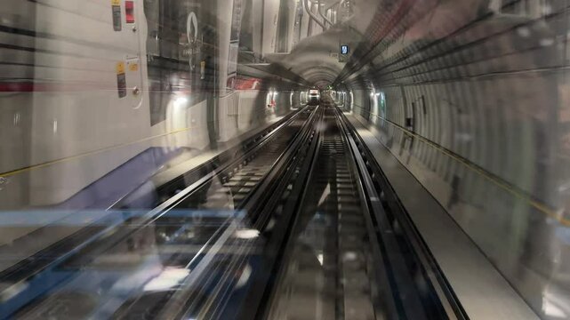 4K. Time lapse automatic train subway tunnel fast speed. Metro subway with a tunnel and a train moving fast. Tube lines in the tunnel. 4K.Time lapse automatic train subway tunnel fast speed
