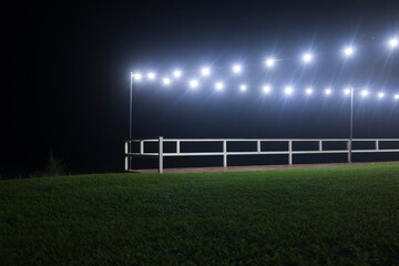 lawn, balustrade and electric lights at night