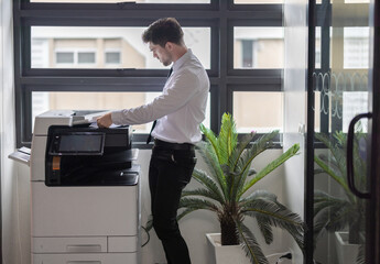 Businessman Using Photocopier
