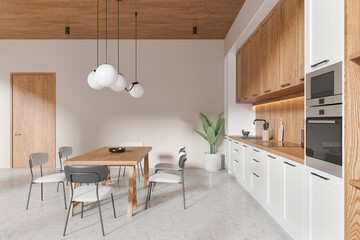 Home kitchen interior with eating table and cooking cabinet, entrance door