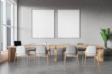 Modern conference room with wooden table, grey chairs, and plants. Large windows on the left. Light and airy office interior concept. 3D Rendering