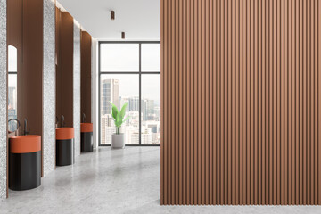 Hotel bathroom interior with sinks and mirrors in row, window. Empty wall