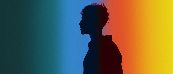 Silhouette of a Person Against a Vibrant Gradient Background with Blue, Green, and Orange Colors