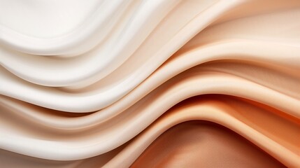 Obraz premium Close-up of smooth, flowing cream and beige fabric folds, showcasing delicate texture and elegant color transition. Perfect for design backgrounds.