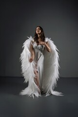 Woman in White Dress With Angel Wings