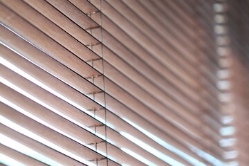 A close-up shot of wooden blinds on a window, suitable for interior design or home decor concepts.