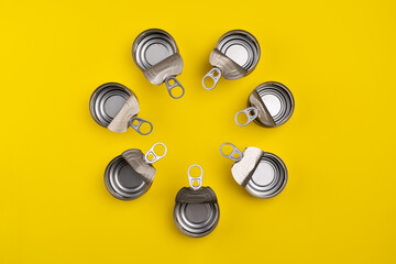 View from above. Recycling concept. Open cans in a circle. Recycling materials. color background