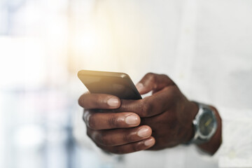 Phone, typing and hand of person in office for online chat, search and mobile app for email review. Scroll, networking and business man at digital agency with smartphone, schedule or web connectivity