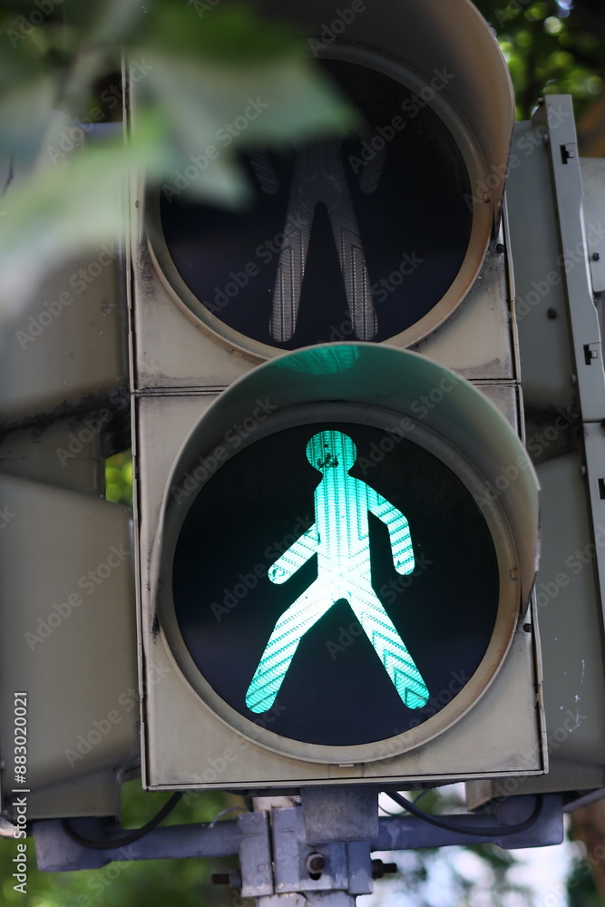 Poster image of a traffic light showing a green arrow, suitable for use in urban or transportation-themed c