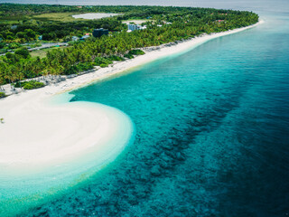 Fuvahmulah island with ocean white sand beach on sunny day