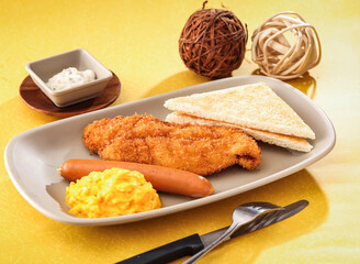 Fish Fillet Mixed with Frankfurter Sausage, Tender Scrambled Eggs, sandwich and dip served in dish...
