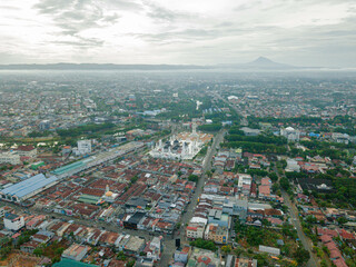 Fototapeta premium Aerial drone view of big city skyline scenery in Banda Aceh, Aceh, Indonesia.