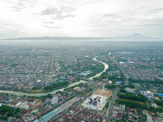 Obraz premium Aerial drone view of big city skyline scenery in Banda Aceh, Aceh, Indonesia.