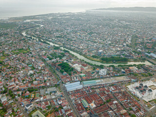 Aerial drone view of big city skyline scenery in Banda Aceh, Aceh, Indonesia.