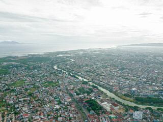 Aerial drone view of big city skyline scenery in Banda Aceh, Aceh, Indonesia.