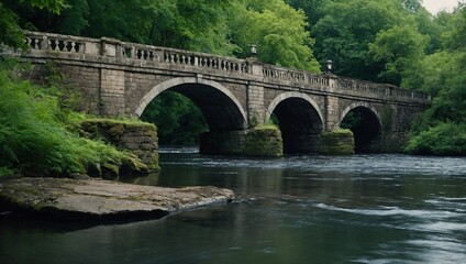 Fototapeta premium An old stone bridge spanning a gently flowing river