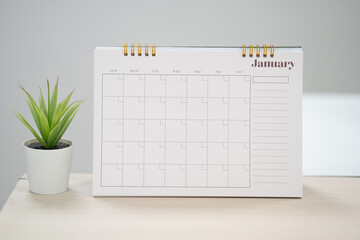 Desk calendar for January  on the table with copy space concept.