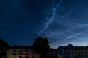 the silvery clouds above Valka's city houses