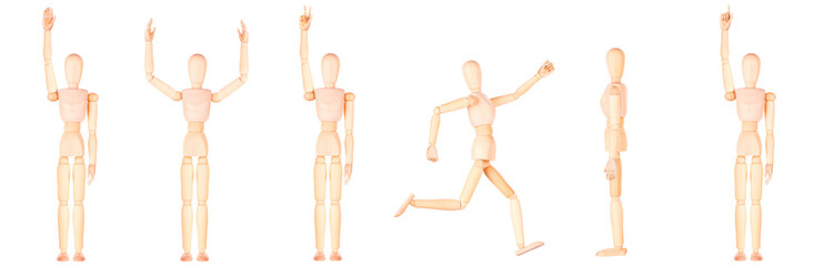 Assortment of wooden mannequins in different stances, isolated on white backdrop