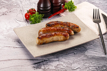 Delicous natural roasted sausages in the plate
