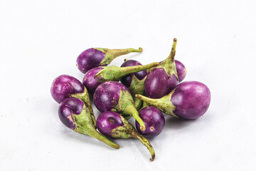Small organic young purple round eggplant
