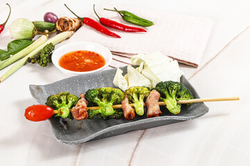 Thai Street foof satay with bacon and broccoli