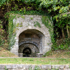 The old and historic leper well on the River Lim Path between Uplyme and Lyme Regis