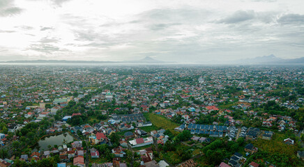 Panoramic aerial drone view of big city skyline scenery in Banda Aceh, Aceh, Indonesia.