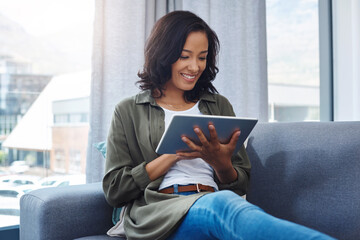 Woman, tablet and home on sofa, happiness and comfortable on couch for ecommerce or online shopping. Communication, website and browsing for streaming show, smile and internet for blog post in house