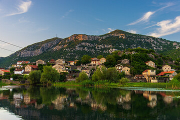 Fototapeta premium Evening view of the small village of Dodoshi on the Crnojevica River. Montenegro
