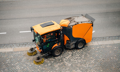 A street sweeper car machine cleaning the streets.