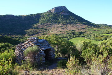 The Vissou and a capitelle seen from the Estabel terrace at the end of May (Hérault, France)