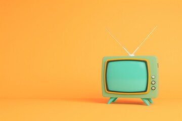 Vintage green retro television set on an orange background with copy space