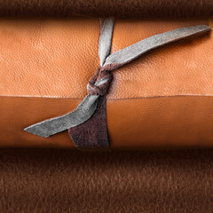 Seamless 4k photo texture photo of brown colored rolled leather material with knots.