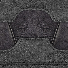 Seamless 4k photo texture photo of black colored leather material with ornate patch and stitched...