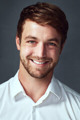 Obraz premium Portrait, smile and man with shirt, studio and proud with internship in bank for bookkeeper and employee. Grey background, professional and clothes for accountant, cheerful and confidence of person