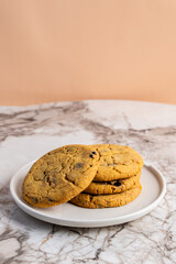 Pile of chocolate chip cookies on a dish