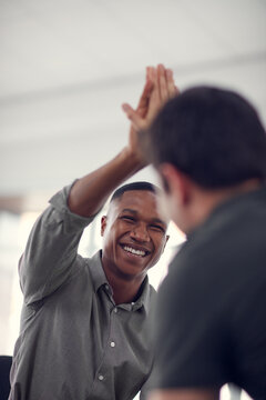 High five, smile and target with business people in office together for celebration, motivation or success. Bonus, goals or support with man employee friends in workplace for congratulations or deal