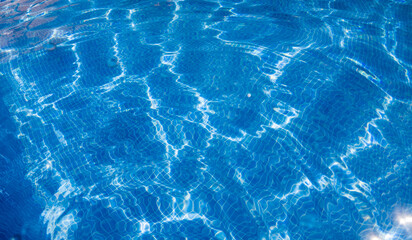 crystal clear blue water in swimming pool