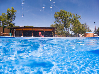 crystal clear blue water in swimming pool