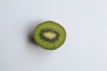 Diagonal cut of kiwi fruit, isolated on white background